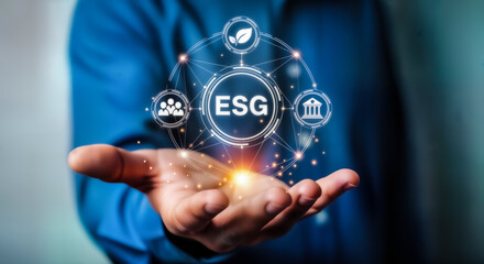 Businessman holding a glowing digital network with esg acronym at its center, symbolizing environmental, social, and governance principles in modern business strategy and sustainable development