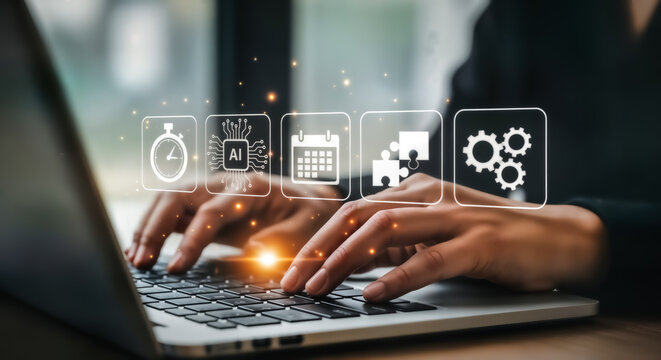 Person working on a laptop with digital icons representing business strategy, planning, and productivity floating above the keyboard