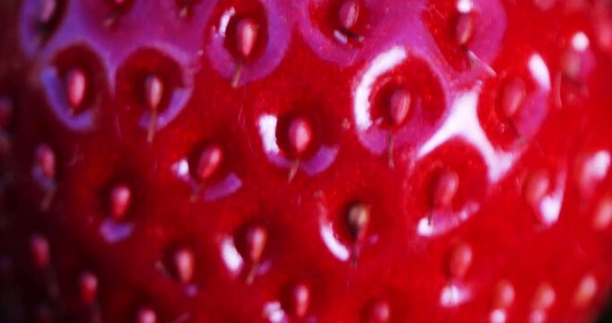Strawberry berry is approaching in close-up