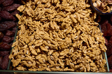 A colorful assortment of mixed nuts and dried fruits beautifully arranged in a market display