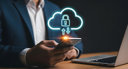 Businessman using smartphone with glowing cloud security icon and laptop