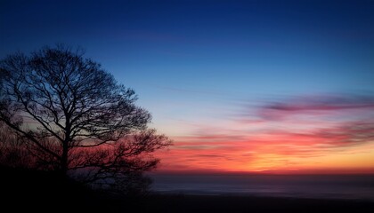 the gradual shift from dusk to night with the imperceptible deepening of colors in the sky