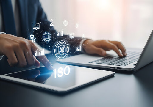 Businessman using tablet and laptop with digital data overlay