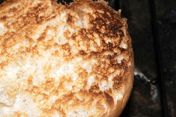 Close up of a toasted bread bap ready for a burger