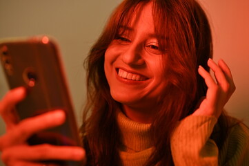 young woman with a mobile phone. positive emotions with smart phone