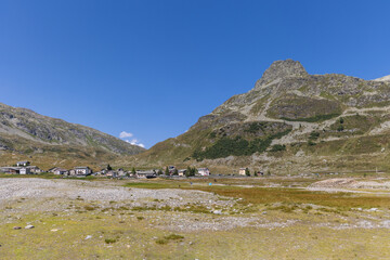 Mountain landscape in the Italian Alps and the Alpine village of Montespluga.
