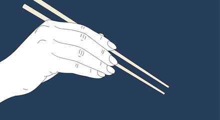 Elegant hand holding chopsticks ready to enjoy delicious asian cuisine