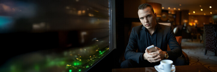 Pensive Man in Lounge Wide Banner