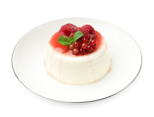 Delicious panna cotta with berries, sauce and mint isolated on white