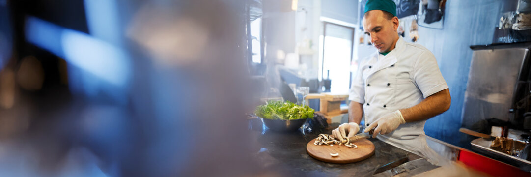 Chef Preparing Food in Kitchen Wide Banner - Powered by Adobe