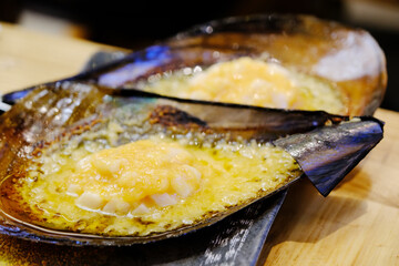 Grilled scallops topped with garlic