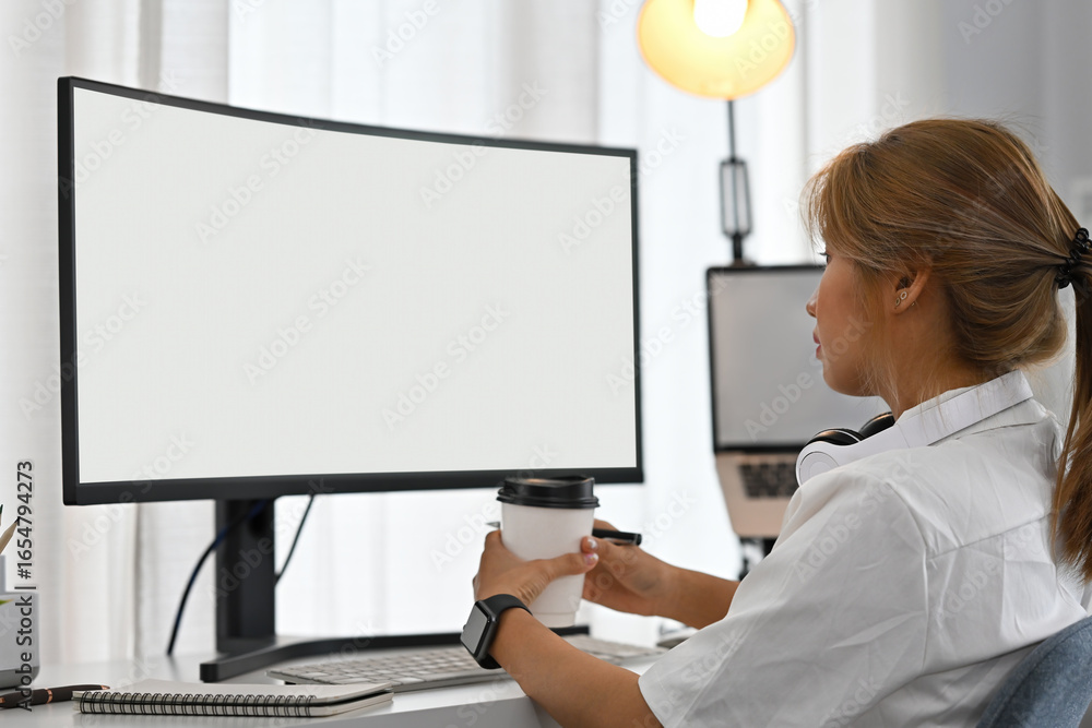 Aufkleber woman software developer in analysis mode, studying screen data with full focus in a tech office