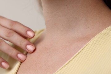 Closeup view of woman on grey background