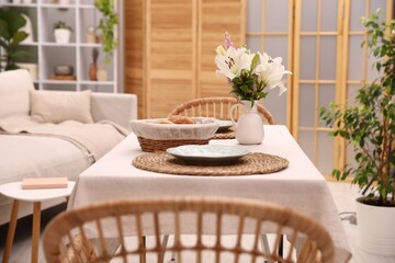Stylish table with chairs and decor in dining room. Interior design