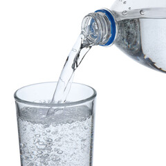 Pouring refreshing soda water from bottle into glass on white background, closeup