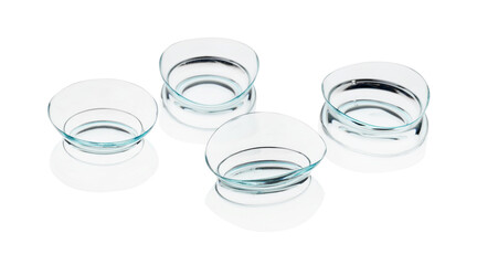 Many transparent contact lenses isolated on white