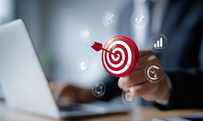 Businessperson targeting goals with a digital target
