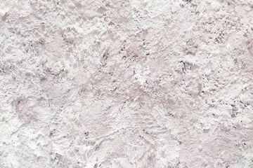 Abstract textured wall, background, with shades of white and delicate p tones.
