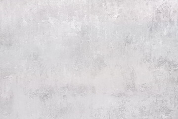 Abstract textured wall, background, with shades of white and delicate p tones.