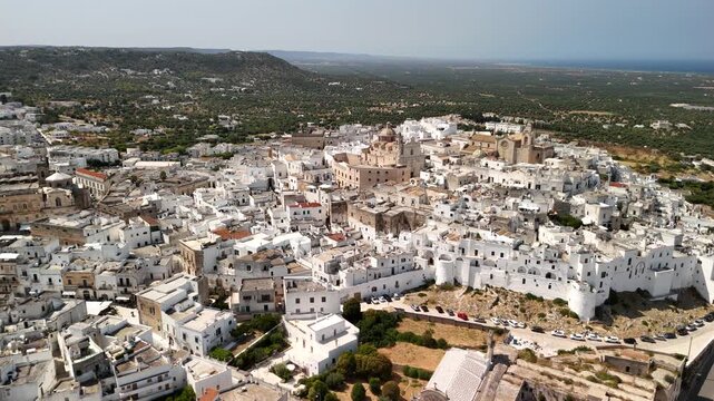 Scenic Aerial Footage of Ostuni, the White Hilltop Town in Southern Italy Surrounded by Historic Architecture