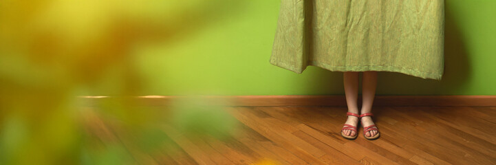 Woman's Feet in Dress on Wooden Floor Wide Banner