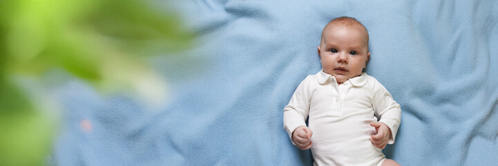 Cute Baby on Blue Blanket Wide Banner with Copy Space