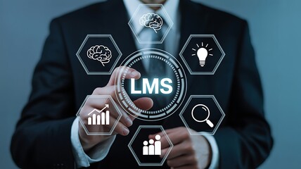Businessman interacting with a digital interface showing the learning management system lms concept with various business and education icons