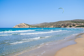 lonely surfer on a sunny beach