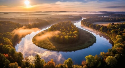 Scenic sunrise over a meandering river surrounded by forests, creating a tranquil, misty landscape. Beautiful river bend on a misty morning.