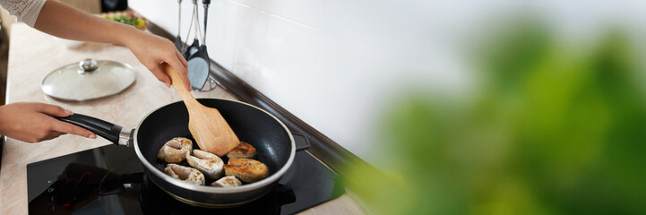 Cooking Fish in Pan with Copy Space Wide Banner