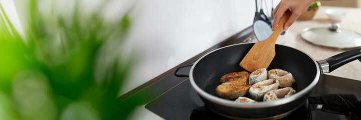 Cooking Fish Fillets in Pan with Copy Space Wide Banner