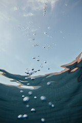 Underwater Serenity Glimpse of Sunlight Through the Surface Bubbles Dancing Towards the Sky Calm and Peaceful