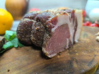 dried meat on the table surrounded by vegetables and fruits. High quality photo