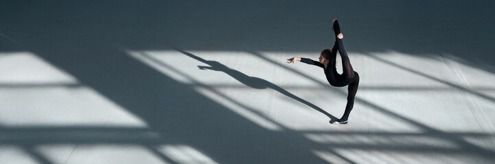 Dancer Stretching Shadow Wide Banner with Copy Space