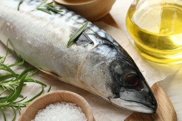 Fresh raw mackerel and spices on table, closeup. Seafood delicacies