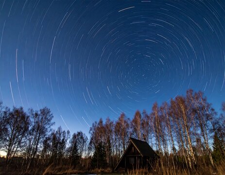 Star trails over a secluded cabin