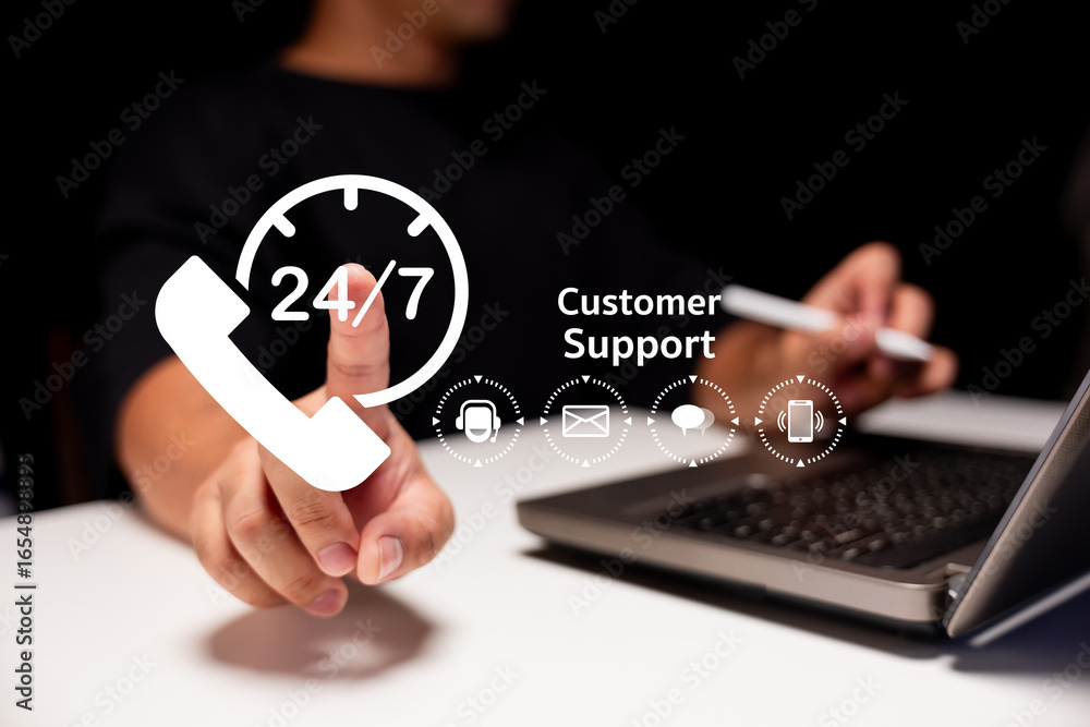 Poster a person gestures towards a 24/7 customer support graphic while using a laptop, symbolizing accessib