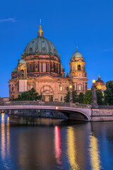 The imposing Berlin Cathedral and the river Spree during blue hour