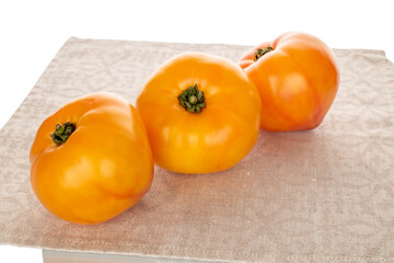 Juicy fresh tomatoes isolated on white background, close-up.