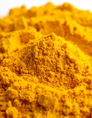 Vibrant turmeric powder on white background