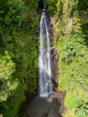 Fototapeta premium Sao Tome and Principe - Waterfall Near Monte Cafe. Scenic Cascade Surrounded by Lush Tropical Rainforest in Central Africa. 