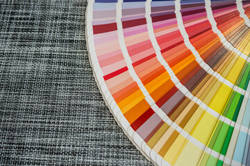 Color palette samples on woven black background for design and printing industry concepts