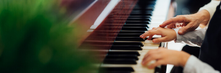 Obraz premium Piano Lesson with Copy Space Wide Banner