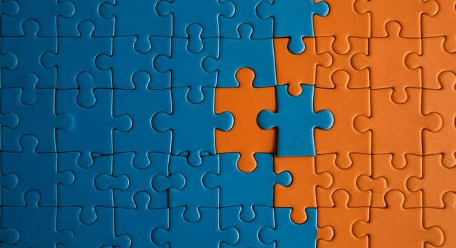 Blue and orange puzzle pieces, nearly complete, representing a solution.