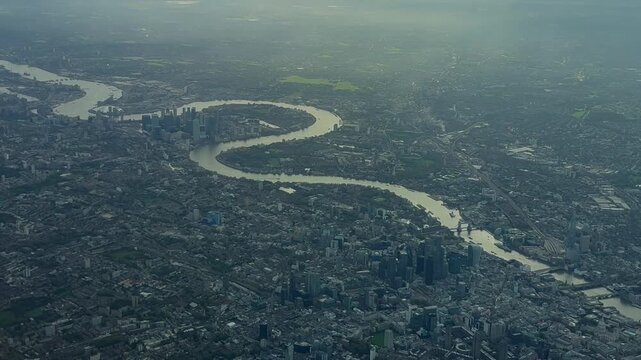 An aerial view down the north bank of the River Thames and downtown London.
