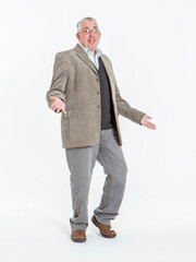 Pleasantly Suprised. A middle-aged man shrugs with his palms facing up showing confused or...
