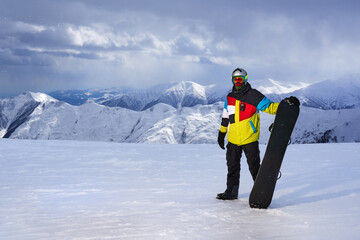 Snowboarder in Colorful Gear on Wide Banner