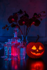 Luxury Halloween Cocktail Bar with Crystal Decanters, Pumpkin Vase, and Black Orchids &ndash; Vertical Premium Lifestyle Photography