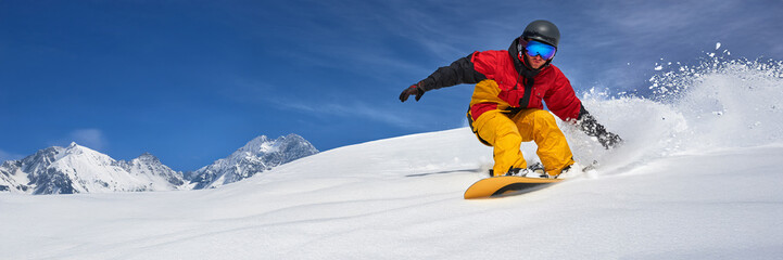 Snowboarder in Action on Snowy Wide Banner