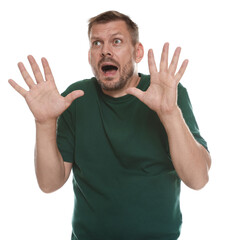 Man suffering from panic attack on white background